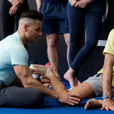 Nevio Roselli working hands-on with an athlete's mobility