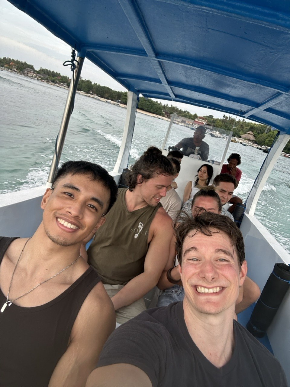 The group on a boat crossing to the islands
